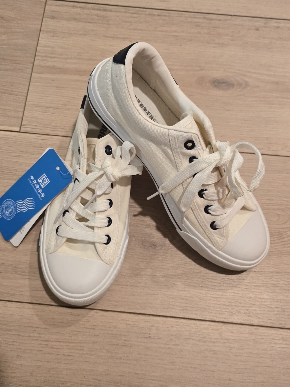 Women's Canvas Lace-Up Sneakers in Cream with Navy Blue Accent